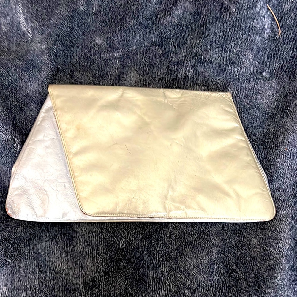 Charles Jourdan vintage two tone gold clutch. In good/used condition.